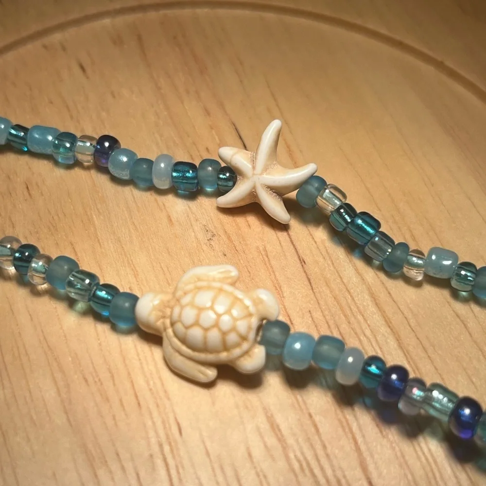 Handmade pack of matching blue beaded bracelets beach theme gold turtle starfish